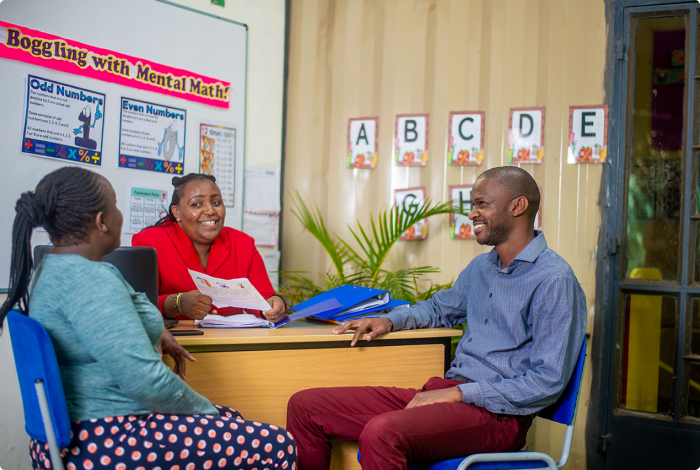 Riara schools teacher & parents conversing at teacher's office