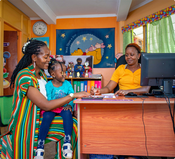 Riara Kindergartens teacher, parent and pupil conversing at teacher's office