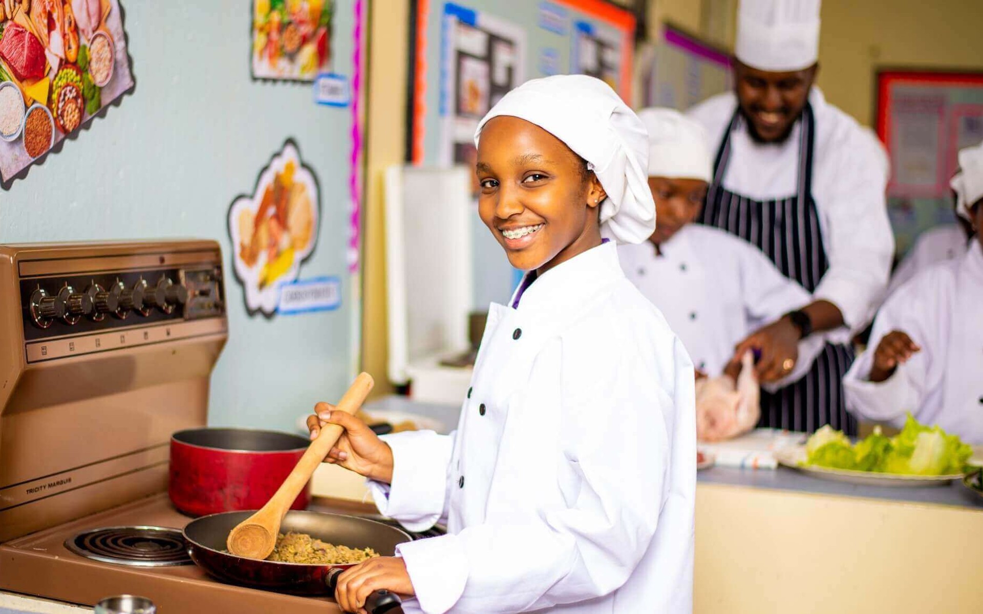 Riara Junior high school students in the kitchen under supervision of their chef teacher